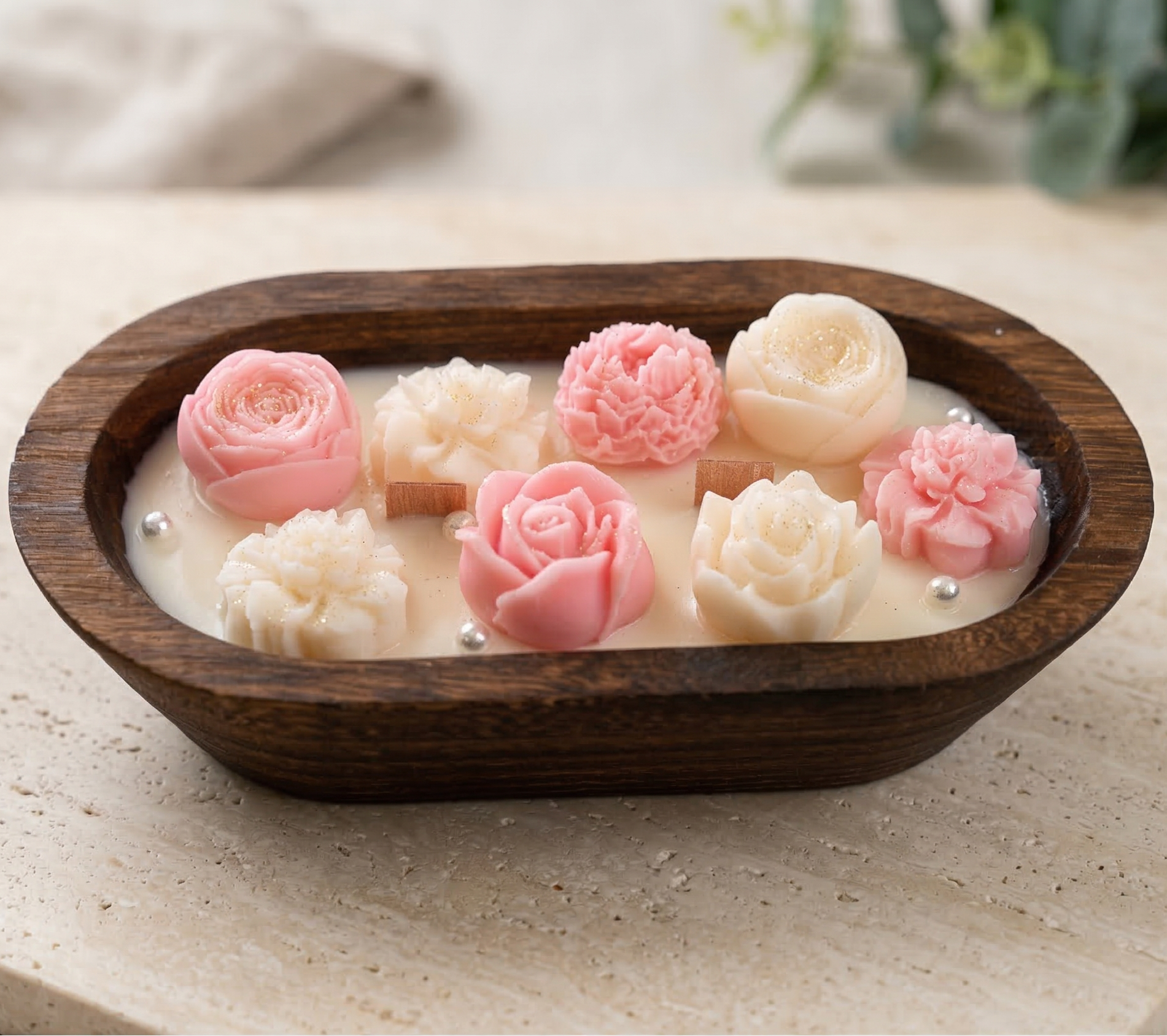Decorative wooden bowl soy candle with handcrafted floral wax pieces for modern home decor.
