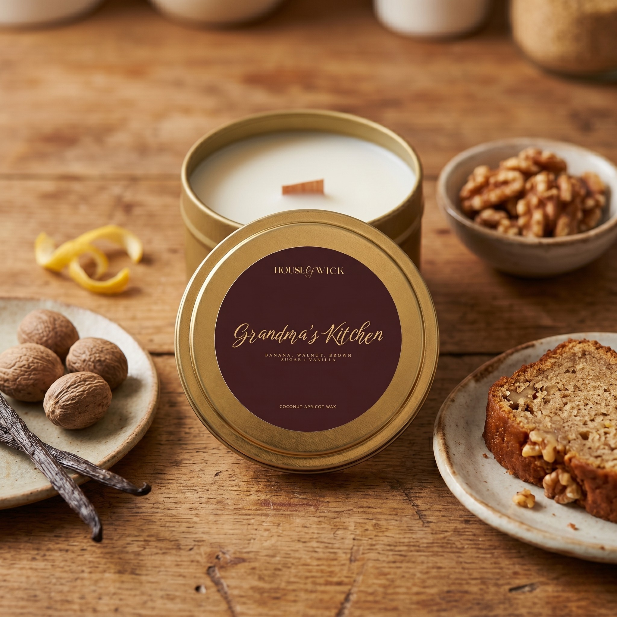 House & Home candle in a decorative tin with ingredients on a wooden surface