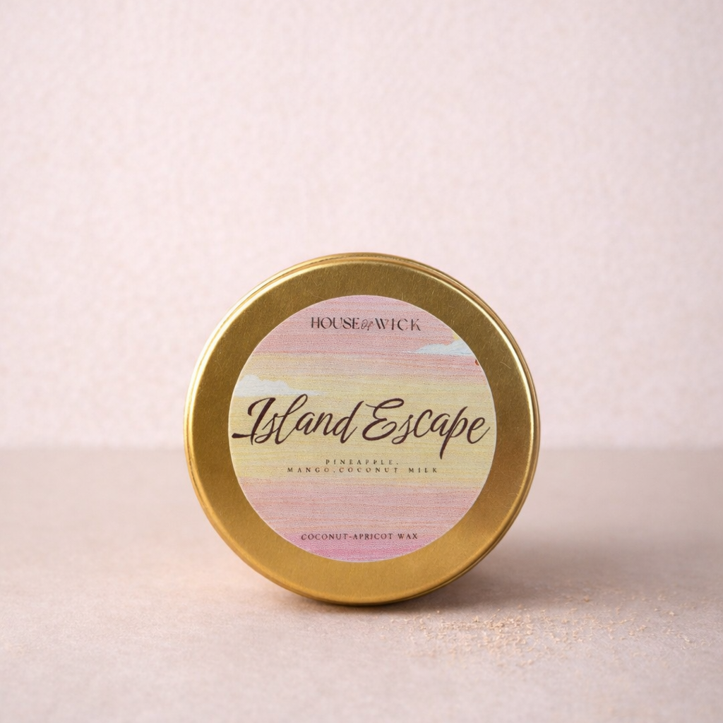 Island Escape 2oz gold tin candle with coconut apricot wax and tropical fruit fragrance notes by House of Wick