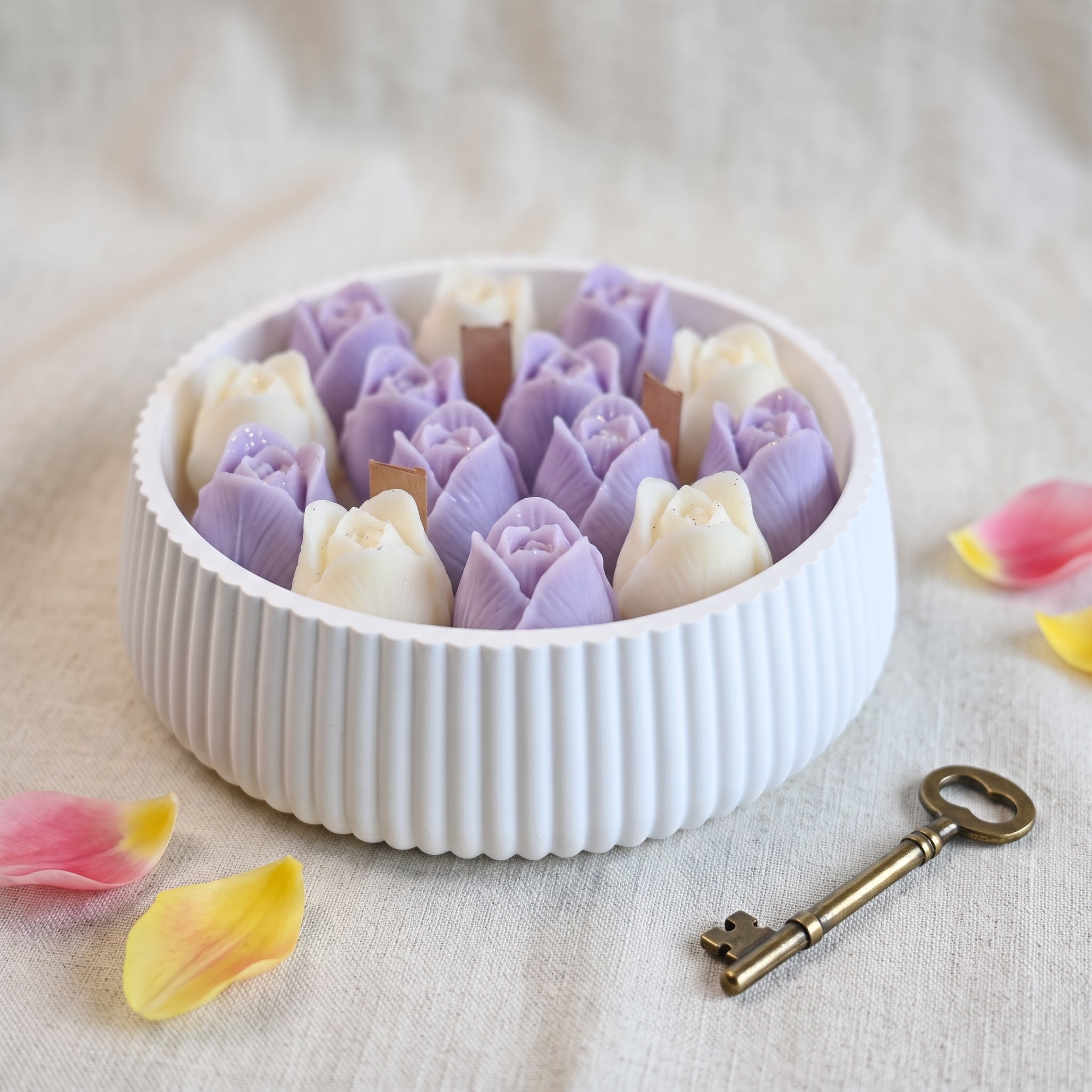House of Wick Tulip Bloom candle with purple and white wax tulips in a ribbed-round bowl
