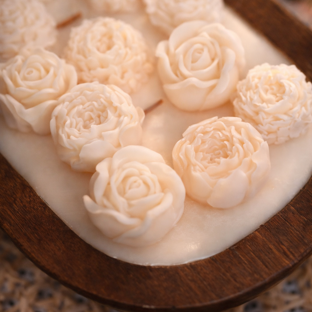 Handmade floral soy wax candle in a wooden bowl by House of Wick featuring sculpted rose wax melts.
