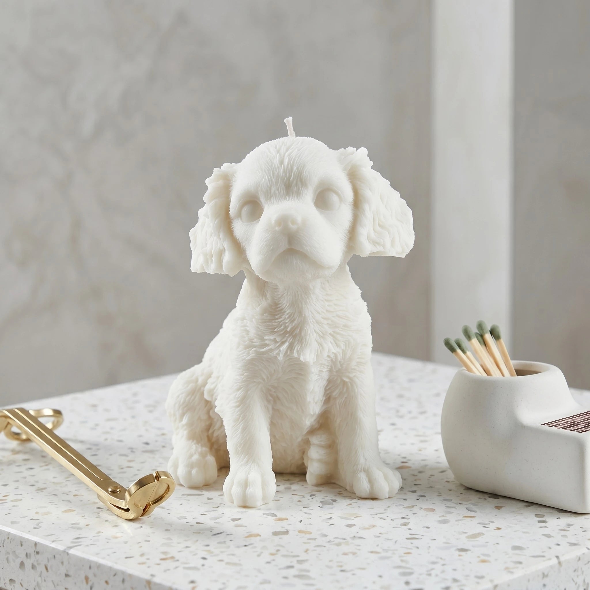 White Cavalier King Charles Spaniel puppy candle by House of Wick — front view product shot.